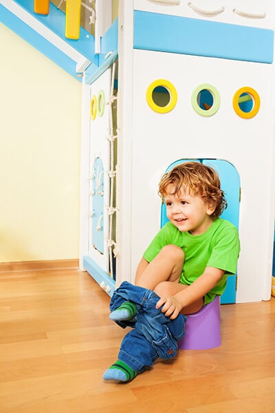 toddler removing pants for potty training