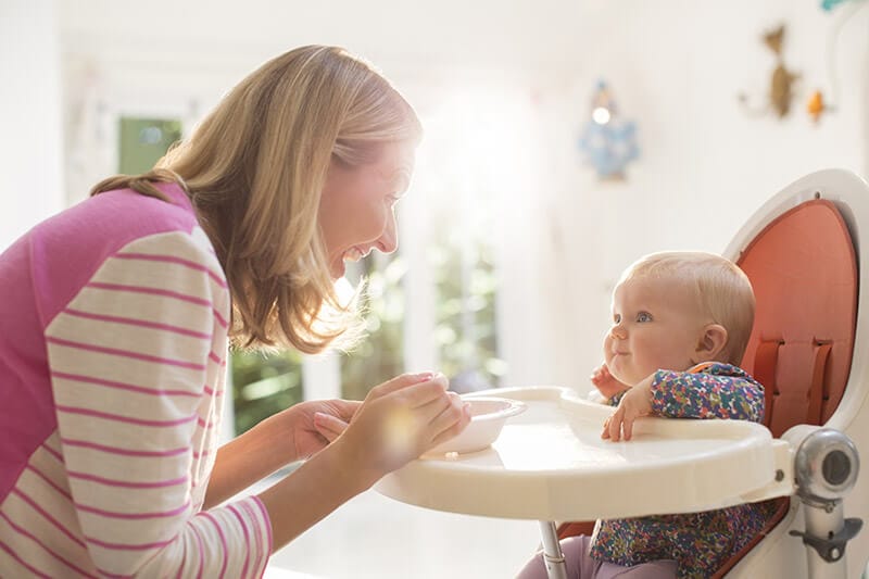 baby sitting in chair with removable tray too high for them