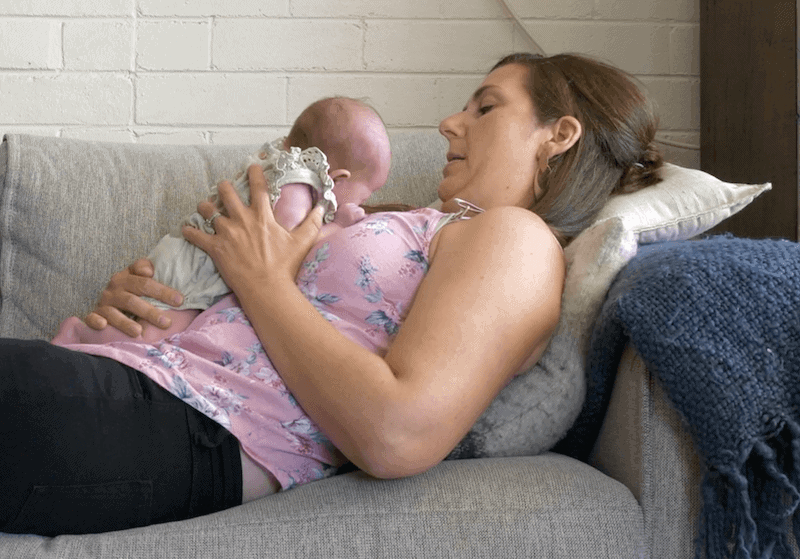 woman with baby on chest doing chest to chest tummy time